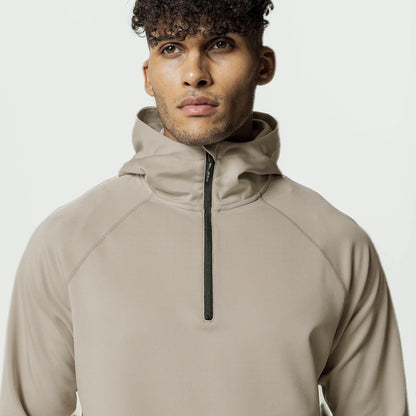 Veste de sport homme à demi-zip et capuche, coupe ample, idéale pour le printemps, l'automne et l'hiver.